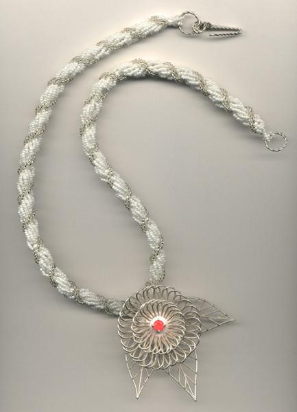 Silver pendant on beaded necklace