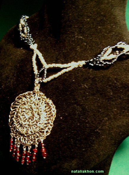 Fine silver crocheted pendant with garnet