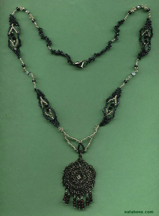 Fine silver crocheted pendant with garnet