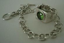 Silver ring with synthetic peridot